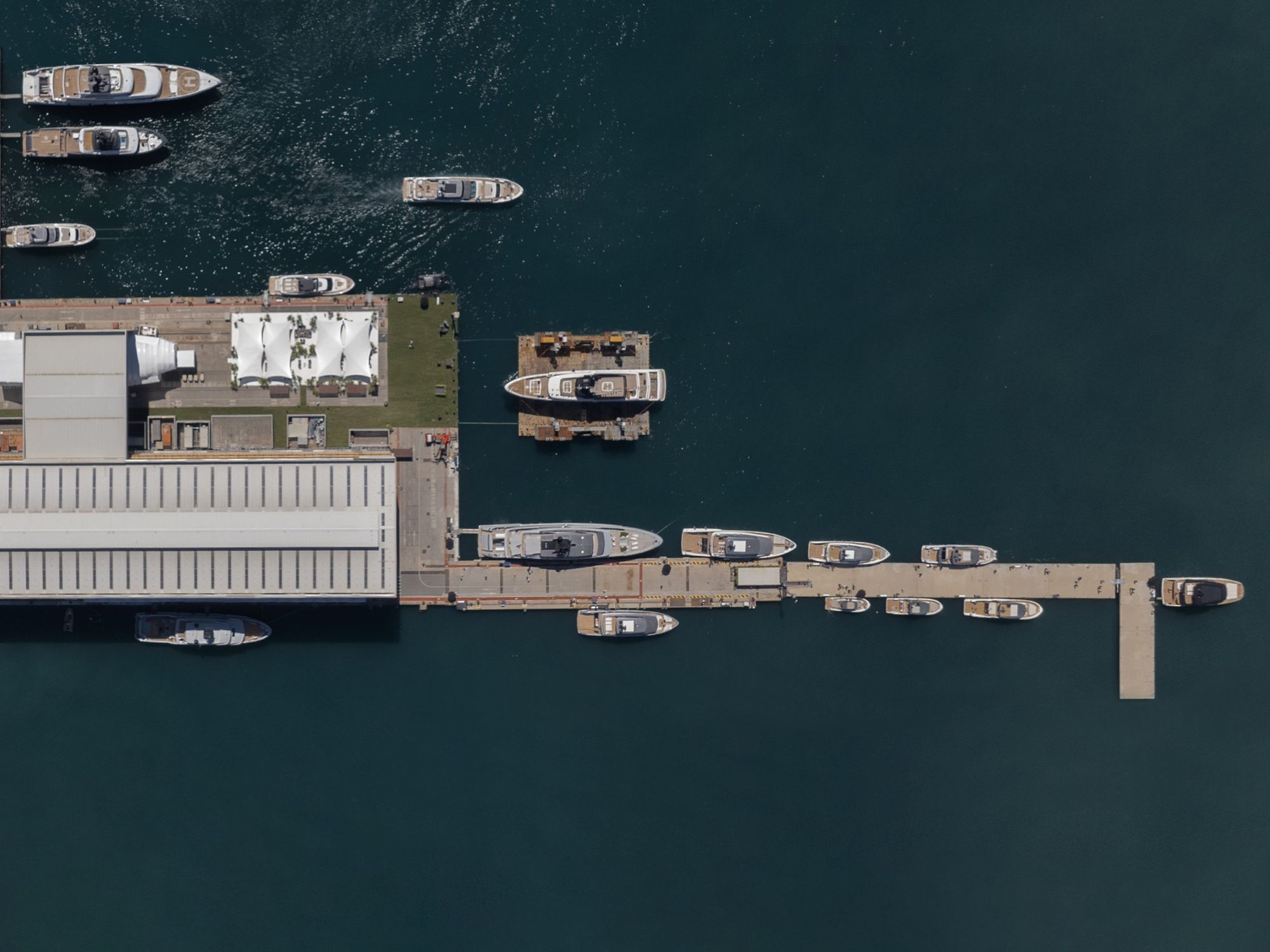 An aerial view of the Sanlorenzo shipyard showing a dock and yachts