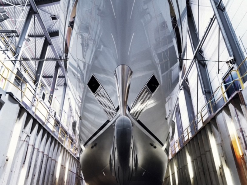 A superyacht hull being painted