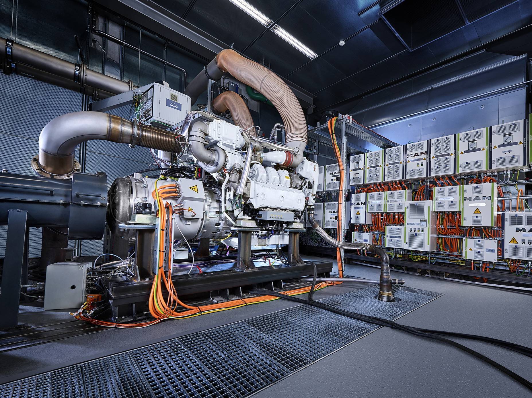 An image of a workshop showing a marine engine being tested
