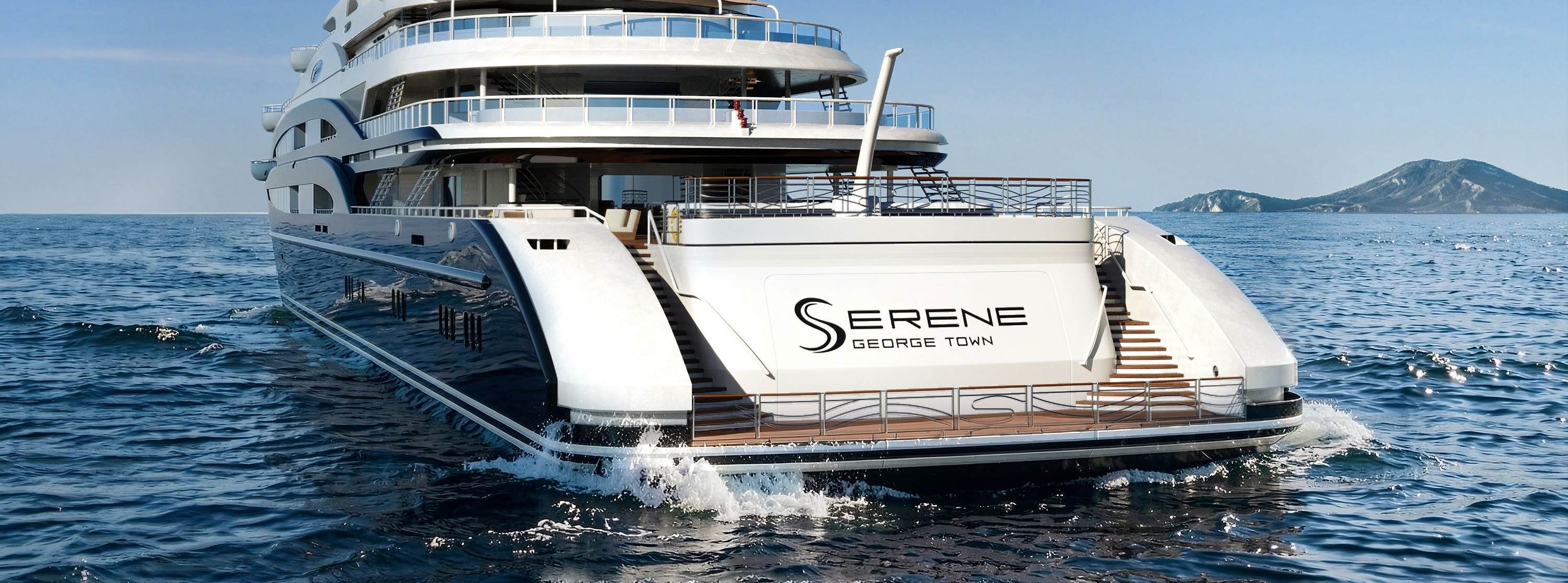 The aft view of a superyacht which appears to be starting its engines
